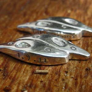 The text is written and the cufflinks are now in fine silver.